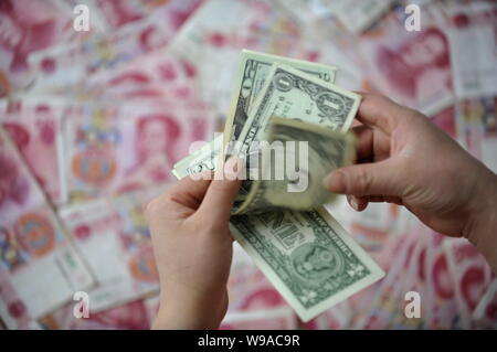 Counting Rmb Counting on Chinese RMB banknote Stock Photo - Alamy