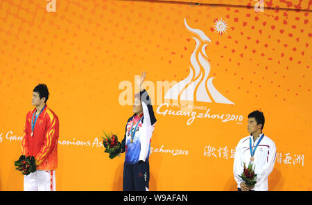 (From left) Chinas Sun Yang (silver medalist), Park Tae-Hwan of South Korea (gold medalist) and Takeshi Matsuda of Japan (bronze medalist) pose on the Stock Photo