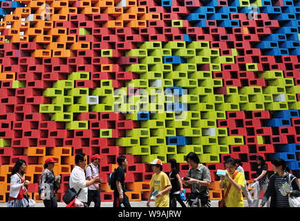 Visitors walk past the Serbia Pavilion in the World Expo Park in Shanghai, China, June 3, 2010.   More than 20 million people have visited the World E Stock Photo