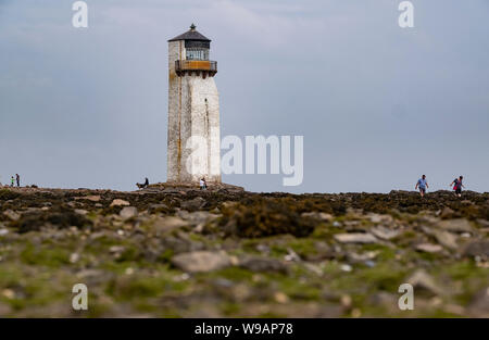 A view of the famous lighthouse at Southerness on the Solway Firth, Scotland.  The lighthouse is the second oldest in Scotland. Stock Photo