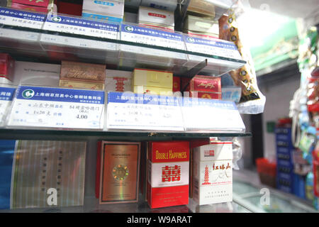 Boxes of cigarette are seen for sale at a shop in Shanghai, China, October  12, 2010. Domestic tobacco monopoly China National Tobacco Corp (CNTC) sa  Stock Photo
