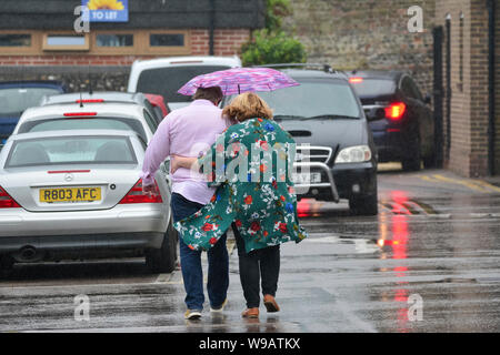 People getting caught in rain storm during sailboat race festivities ...