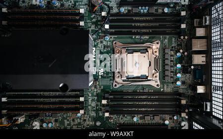 Paris, France - May 31, 2019: CPU thermal paste grease applied on a second Intel Xeon 2687w V4 CPU processor in Dell Precision professional workstation Stock Photo