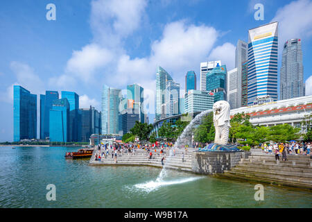 Singapore, Singapore - August 10, 2018:  Merlion statue fountain in Merlion Park. Marina Bay is a bay located in the Central Area of Singapore. Stock Photo