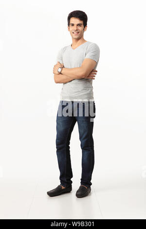 Young handsome Indian man with arms crossed Stock Photo - Alamy