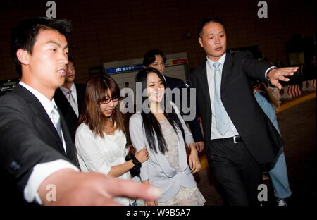 Japanese AV star Aoi Sola, center, poses next to Chinese Internet ...