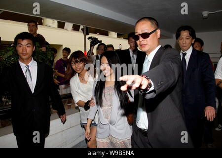 Japanese AV star Aoi Sola, center, poses next to Chinese Internet ...