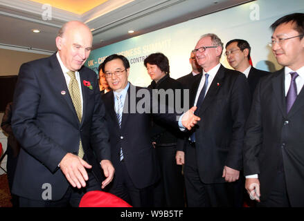 UK Business Secretary Vince Cable, left, and Gao Hucheng, second left, Vice Minister of Commerce of China, and representatives of Chinese and British Stock Photo