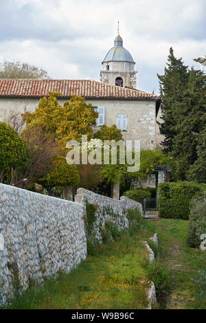View on the monastery bell tower from the garden. Monastere de Cimiez Garden in Nice, France. Stock Photo