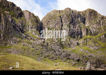 The so-called Devil's Kitchen is at the head of Cwm Idwal (a cirque or corrie) in the Glyderau Range of the Snowdonia National Park. Stock Photo