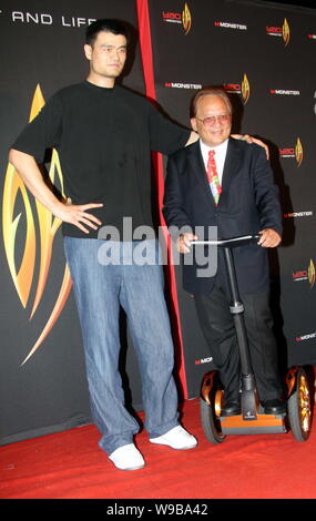 Chinese basketball player Yao Ming of the Houston Rockets stands next to Noel Lee, founder and CEO of Monster Cable Products Inc. during a press confe Stock Photo