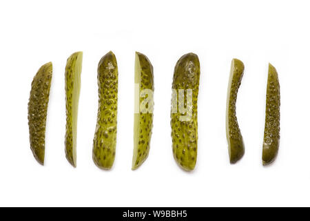 Slices of marinated pickled Cucumbers isolated on white background, top view Stock Photo