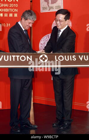 TOKYO, Japan - Yves Carcelle (C), chairman and CEO of Louis Vuitton  Malletier, joins hands with Kyojiro Hata (L), outgoing president of Louis  Vuitton Japan and Kiyotaka Fujii, next LVJ president, during
