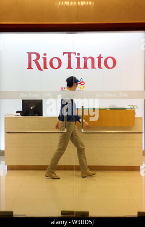 An Employee Walks Past The Front Desk At The Shanghai Office Of