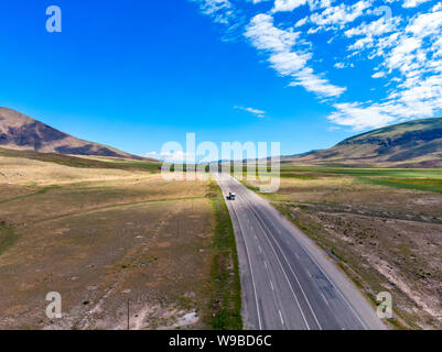 Aerial view of the road leading to Dogubayazit from Igdir. Plateau around Mount Ararat, mountains and hills. Eastern Turkey on the border with Iran Stock Photo