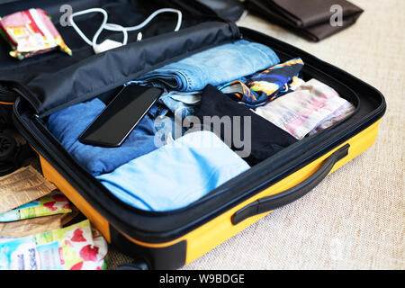 https://l450v.alamy.com/450v/w9bdge/an-open-suitcase-with-mens-clothing-packed-for-a-business-trip-or-travel-w9bdge.jpg