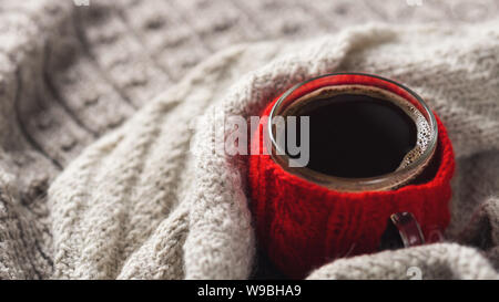 Hygge style coffee Cup. Home comfort in the cold season. Warm, minimalist sweaters Stock Photo