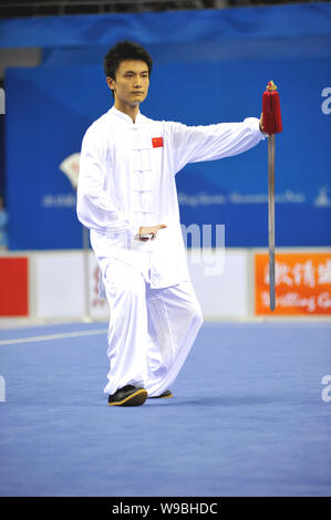 Chinas Wu Yanan competes in the mens Wushu Taijijian at the 16th Asian ...