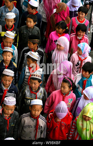 Hui ethnic students are seen on the playground at the Heping Primary School in Linxia, northwest Chinas Gansu province, June 30, 2010.   Heping Primar Stock Photo