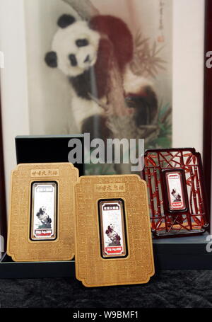Panda-themed silver bars for the World Expo 2010 are seen during a launch ceremony in Shanghai, China, 23 March 2010.   Souvenir gold and silver bars Stock Photo