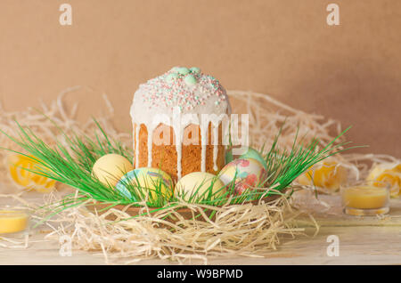 Pastel Easter egg. Pastel colored decorated easter eggs and Easter cake. Pastel colored Easter holiday background. Sweet spring color theme. Easter eg Stock Photo