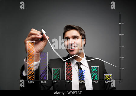 Businessman drawing a success chart Stock Photo