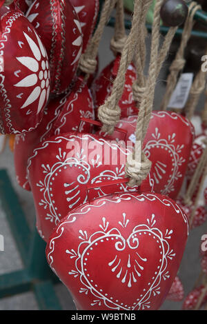 decoration heart made of sheet fixed with a rope of natural hemp for selling on a Christmas market Stock Photo