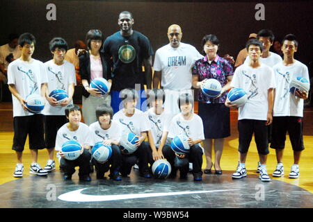 NBA player LeBron James of the Cleveland Cavaliers, back fourth left, poses with young Chinese basketball players during a campaign in Shenyang city, Stock Photo