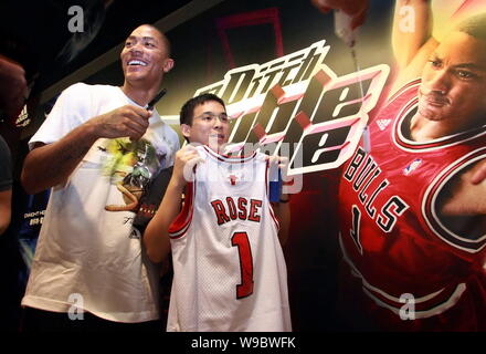 Chicago Bulls' Derrick Rose holds NBA Rookie of the Year trophy on  Wednesday, April 22, 2009, in Northbrook, Ill. Rose became the third Bulls  player to win the award Wednesday, joining Michael