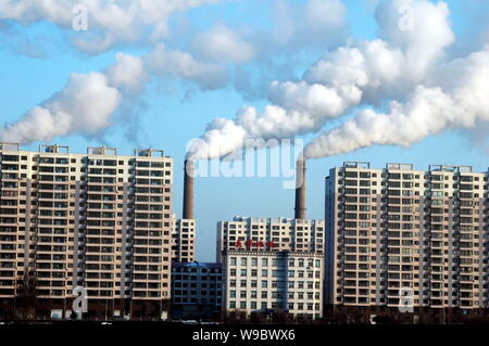 --FILE--Smoke is seen being emitted from chimneys at plants at the bank of Songhua River in Jilin city, northeast Chinas Jilin province, 19 November 2 Stock Photo