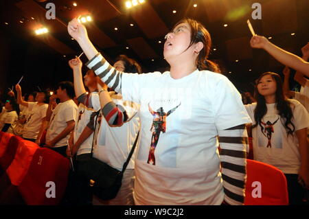 Chinese Michael Jackson fans sing Heal The World, a song of Michael Jackson, during a commemorative ceremony prior to the premiere of Michael Jacksons Stock Photo