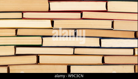 abstract texture from stacks of various hardback books, full frame, concept back to school Stock Photo