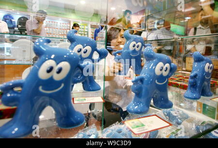 Expo 2010 mascot Haibao figures are seen for sale as souvenirs of the World Expo 2010 Shanghai at Beijings first World Expo 2010 Shanghai licensed pro Stock Photo