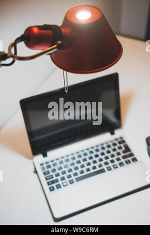 Personal computer standing on the table at late evening. Stock Photo