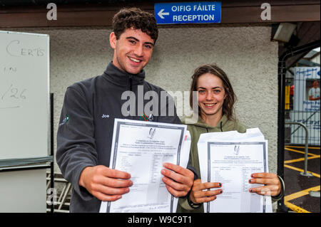 Schull, West Cork, Ireland. 13th Aug, 2019. Almost 59,000 students were due to receive their Leaving Cert results today, a day earlier than previous years. Receiving their results at Schull Community College were Joe Arundel McSweeey and Lucy O'Callaghan, both from Schull. Credit: Andy Gibson/Alamy Live News Stock Photo