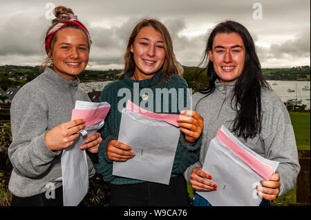 Schull, West Cork, Ireland. 13th Aug, 2019. Almost 59,000 students were due to receive their Leaving Cert results today, a day earlier than previous years. Checking their results were Eva Goggin, Schull; Niamh Connolly, Ballydehob ad Aoife Quinn, Skibbereen. Credit: Andy Gibson/Alamy Live News Stock Photo