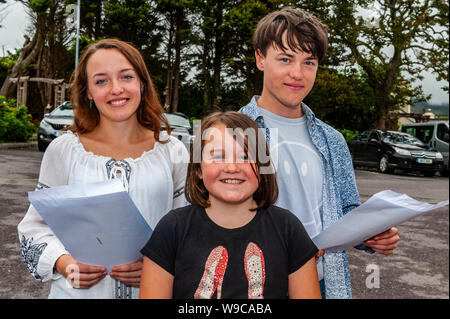 Schull, West Cork, Ireland. 13th Aug, 2019. Almost 59,000 students were due to receive their Leaving Cert results today, a day earlier than previous years. Checking their results were Ana and Kit Barrett with their younger sister, Rosa Barrett, all from Ballydehob. Credit: Andy Gibson/Alamy Live News Stock Photo