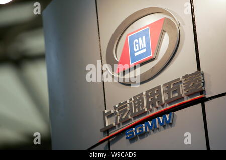 --FILE--The logos of SGMW (SAIC-GM-Wuling) and Shanghai GM, the joint venture between General Motors and SAIC (Shanghai Automotive Industry Corporatio Stock Photo