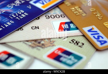--FILE--Logos of China UnionPay, Visa and MasterCard are pictured at a ...