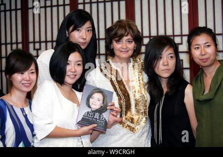 Cherie Blair, third right, wife of former British Prime Minister Tony Blair, poses with Chinese netizens during an event to promote the Chinese versio Stock Photo