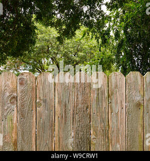 Privacy And Security Provided By A Rustic Wood Backyard Fence With