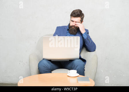 A successful business relies on technology. Businessman working at laptop technology for running business. Bearded man using technology in communication with customer. Business technology. Stock Photo