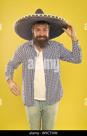 Mexican bearded guy ready to celebrate. Customs and traditions. Man wear sombrero mexican hat. Vacation travel festival and holidays. Join fest. Mexican culture concept. Celebrate mexican holiday. Stock Photo