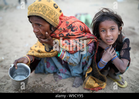 Gypsy mother and child at the Pushkar Camel Fair, Rajasthan. The fair is the largest camel fair in India. Stock Photo