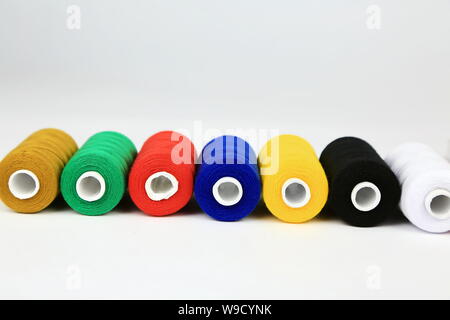 Yarn in different colors isolated against white background Stock Photo