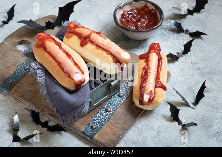 Creepy Halloween hot dogs look like a bloody fingers Stock Photo