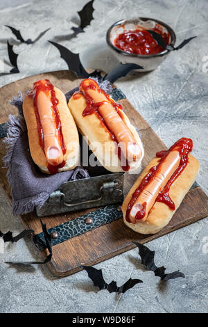 Creepy Halloween hot dogs look like a bloody fingers Stock Photo