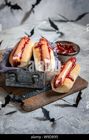 Creepy Halloween hot dogs look like a bloody fingers Stock Photo