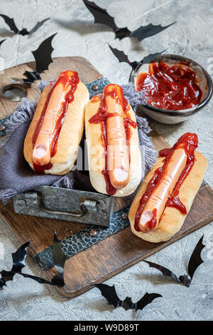 Creepy Halloween hot dogs look like a bloody fingers Stock Photo