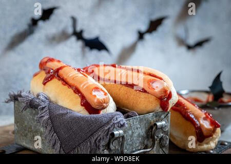 Creepy Halloween hot dogs look like a bloody fingers Stock Photo